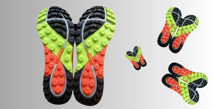 Running Shoe with black, orange and Pastage Tread for Optimal Performance.